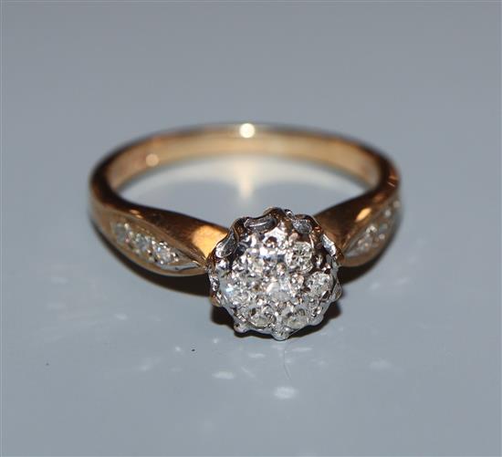 A 9ct gold diamond cluster ring, total diamond weight approximately 0.20cts, size K.